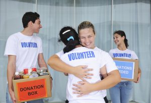 happy volunteer group with food donation